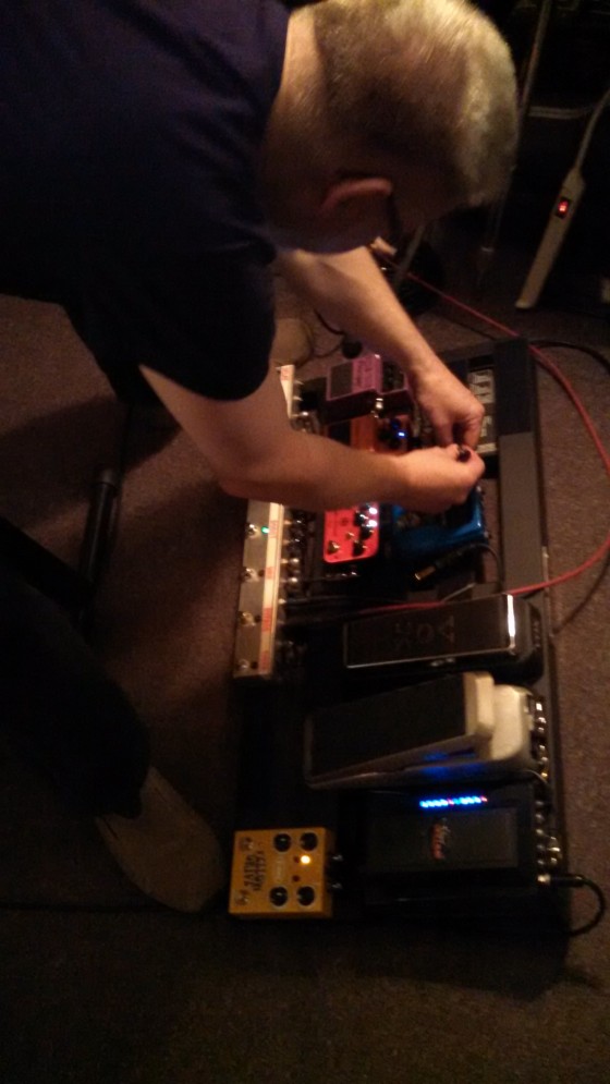 Bill Shannon, fiddling with his pedalboard.