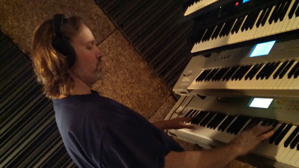 Andrew Colyer lays down rough keyboard tracks in The Cave.